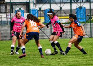 Girls women playing soccer football