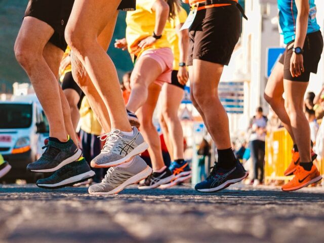 People getting ready to run, sneakers, running on road