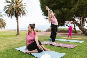 Ladies stretching and yoga in park